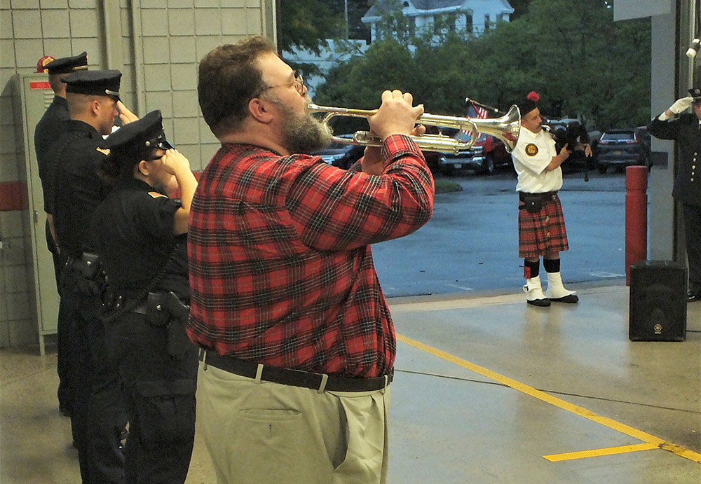 Joe Avampato played a call/response version of Taps with fellow bugler Peter Maroldt